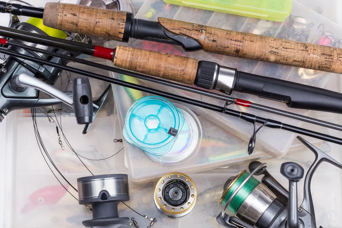 Fishing rods reels and tackle spread out