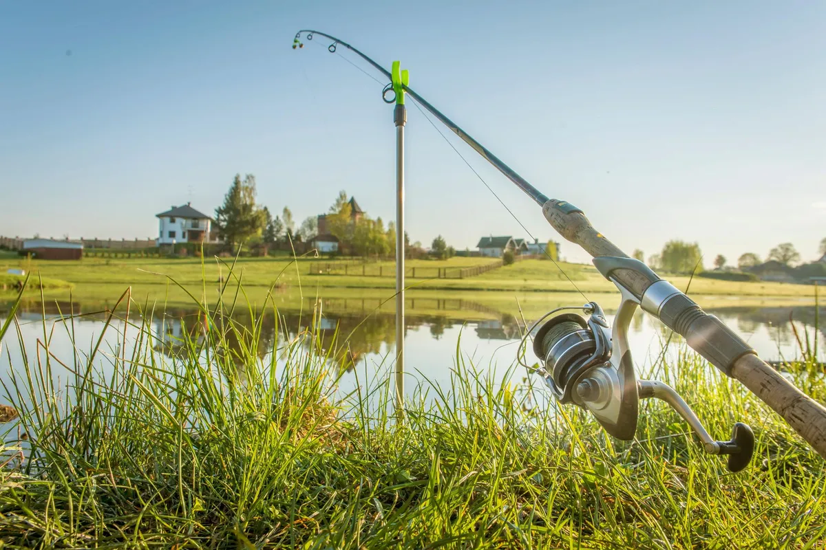 Spinning rod and reel at sunset on an Indiana pond